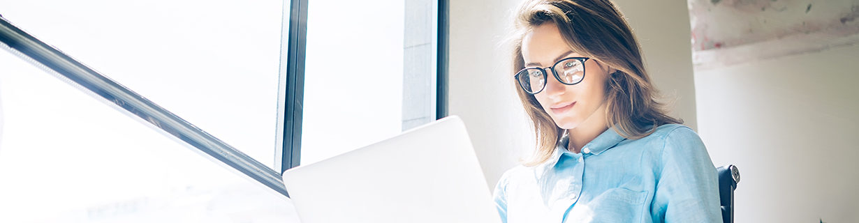 woman with laptop, using tech
