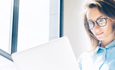 woman with laptop, using tech